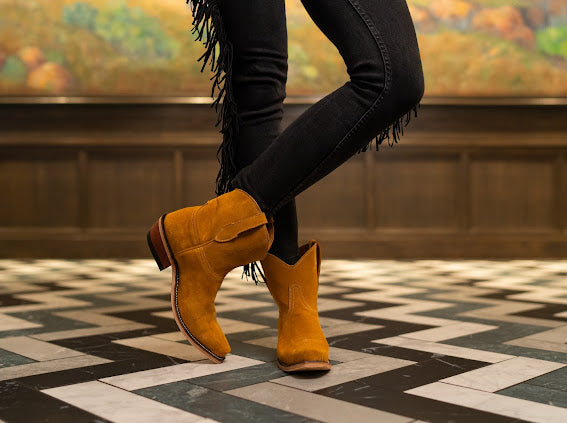 
                  
                    Woman wearing The Abella Snip Toe Ankle Boot with Jewel Italian Suede
                  
                