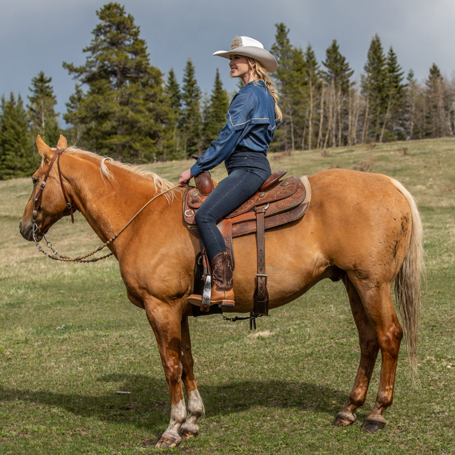 
                  
                    Woman on Horse Wearing a two tone western Boot
                  
                